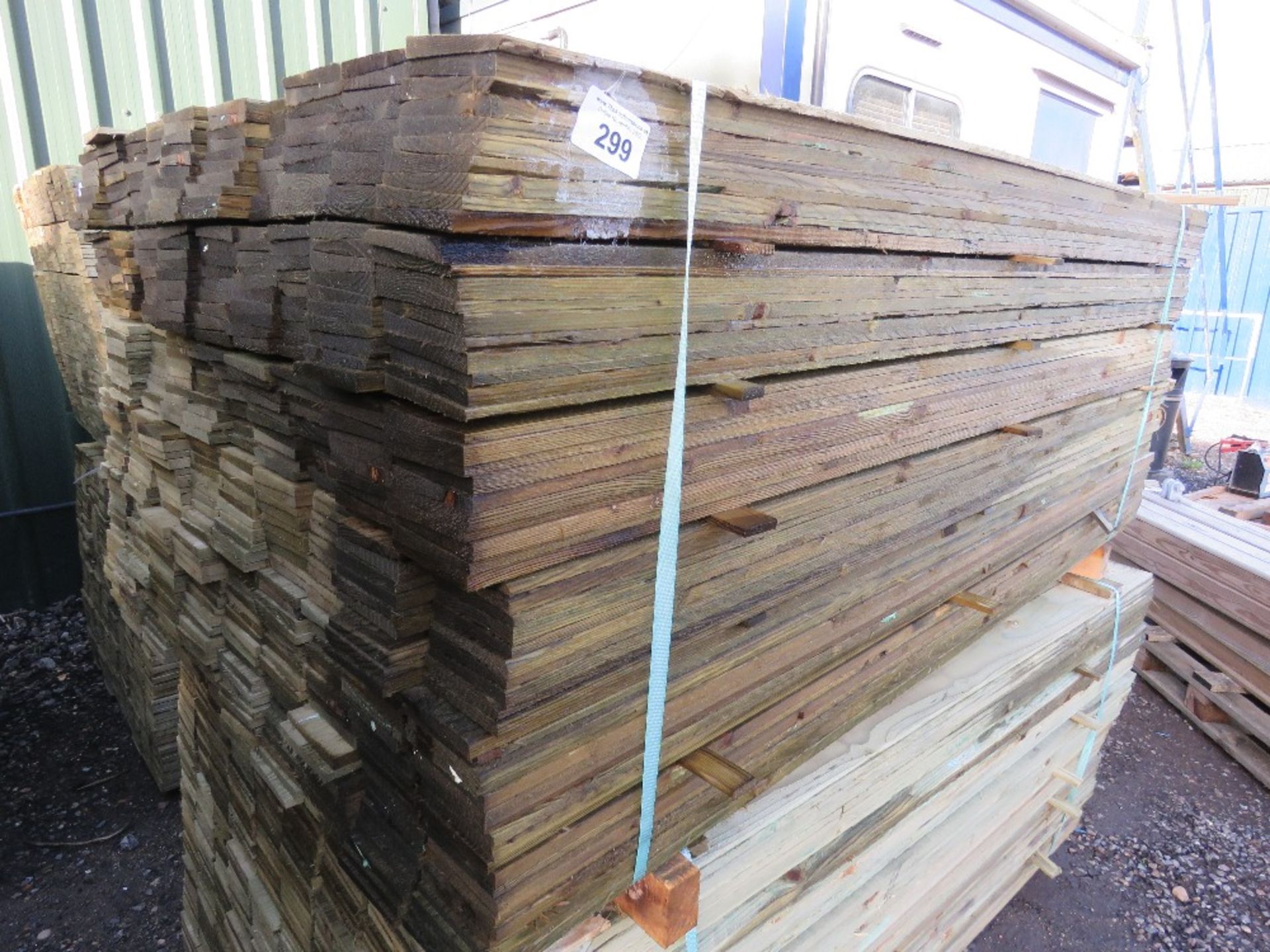 LARGE PACK OF PRESSURE TREATED FEATHER EDGE CLADDING TIMBER BOARDS. 1.8M X 100MM APPROX.