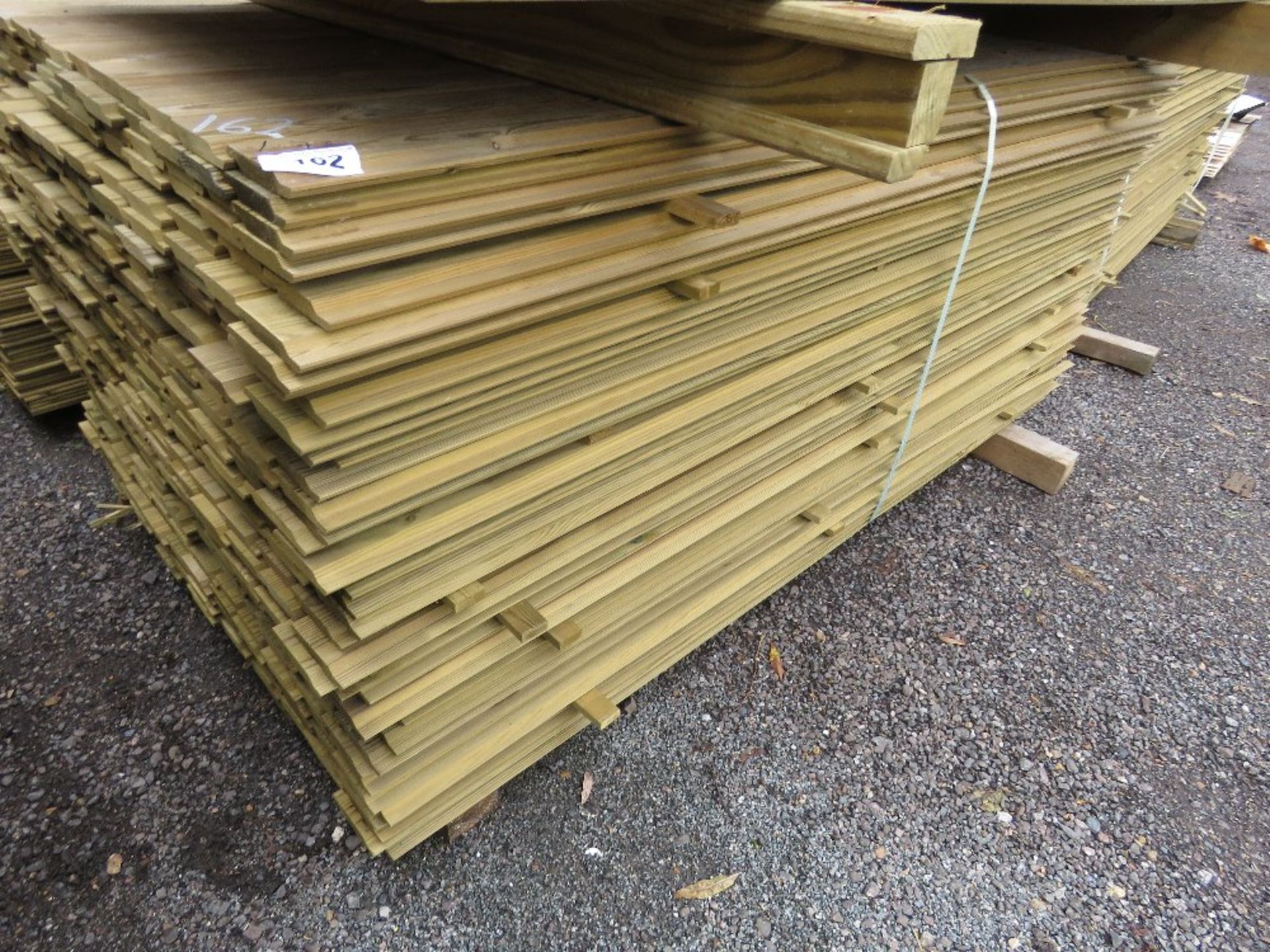 LARGE PACK OF TREATED SHIPLAP TIMBER CLADDING BOARDS. 1.73M LENGTH X 95MM WIDTH APPROX.