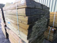 LARGE PACK OF PRESSURE TREATED FEATHER EDGE CLADDING TIMBER BOARDS. 1.35M X 100MM APPROX.