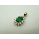 18ct white gold emerald and diamond pendant