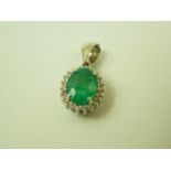 18ct white gold emerald and diamond pendant