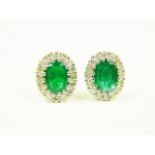 Pair of 18ct white gold emerald and diamond earrings