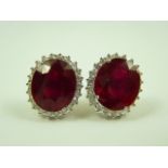 Pair of 18ct white gold ruby and diamond earrings