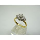 18ct yellow gold ring with 7 stone diamond floral cluster.