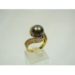 Black pearl and diamonds gold ring