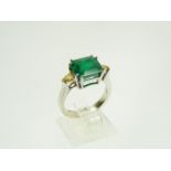 18ct white gold, emerald and diamond ring