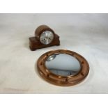 A twentieth century walnut cased mantle clock together with a reproduction convex metal mirror 42cm