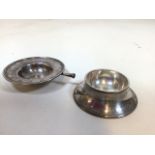 A Tiffany and Co tea strainer and bowl with engraved design. Initials MWE ( wooden handle missing)