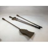 A set of fire irons - Three pieces. H:73cm