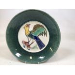 A Marazion Pottery platter of a sea eagle with fish W:34cm