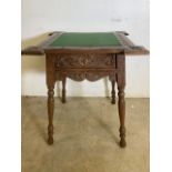 An oak card table with carved details and turned legs, lift up hinged lid to storage. W:60cm x D: