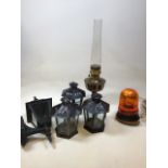 An Aladdin oil lamp No 23, height 61cm together with three tea light lanterns, an electric garden