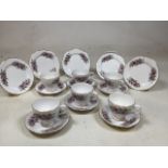 A Royal Kent bone China tea set. Six cups and saucers and five teap plates