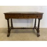 A walnut leather topped writing table with two drawers and large stretcher to base. W:107cm x D:61cm