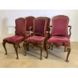 A Set of six early 20th century oak dining chairs with upholstered backs and drop in seats.