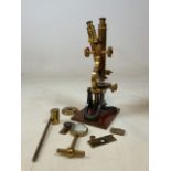 A boxed brass Microscope. H. Hughes and sons Fenchurch street London. A late Victorian lacquered and