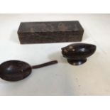 Two coconut shell carved items. A spoon, a trinket box also with a carved wooden box depicting