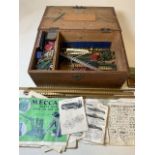 A Large quantity of early Meccano and instruction manuals in pine box.