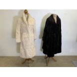 Two fur full length coats. A 1950s coat with turn back cuffs and a cream coney in good condition