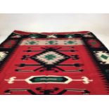 A Fine Turkish Kilim in black and red design W:123cm x H:191cm