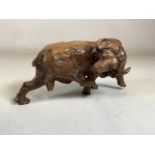 A finely carved statue of a bull. W:24cm x H:12cm