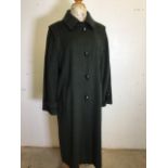 A vintage Hucclecote Leisurewear Loden ladies full length coat. 75% wool 25% polyamide. Size 16