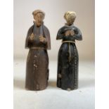 A pair of continental wooden religious triptych shrine figures with nodding heads. H:14cm
