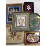 Six framed material and floral pictures. Including lace, silk, needlework and dried and pressed