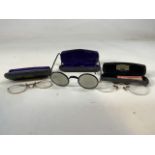 Three pairs of early spectacles in original cases from opticians in Australia Germany and London