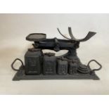 A Set of cast iron scales and weights W:40cm x D:23cm x H:20cm