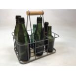 A milkmans crate with glass bottles including Rogers of Bristol, Starkey Knight and Ford and A H