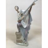 A Lladro figurine in theatrical costume - a lute player. An imposing piece. Repair to hand - see