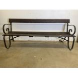 A Victorian style garden bench with scroll arms and support stretchers. W:183cm x D:70cm x H:76cm