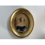 A Victorian portrait miniature on paper in gilt oval mount. Painted in watercolour and gouache. With