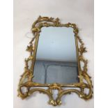A vintage gilt wood framed decorative mirror A/F W:53cm x H:85cm