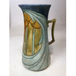 An Art Nouveau Minton Secessionist ware wash jug. Printed to base Minton Ltd No 8 H:35cm