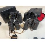 Four pairs of binoculars in cases. Carl Ziess, boots and Belmont De Luxe.