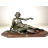 A french spelter figurine with dog. On oak plinth. H:29cm