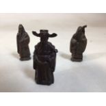 Three Oriental bronze figures. Tallest is 9cm