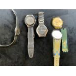 Various Swatch watches.