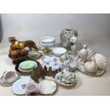 A box of mixed ceramics including plates, tea cups and saucers, chess pieces, animals and other