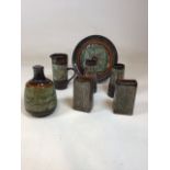 A collection of Newlyn Celtic Pottery including 5 vases a jug and a plate Tallest vase 19cm