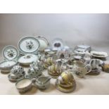 A part dinner service of Woods Ware Clovelly, with oval plates, tea plates, cups and saucers and a