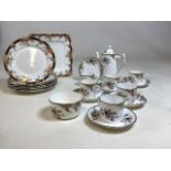 A Wesley China coffee set for six decorated with birds, ( repair to one cup and hairline crack to