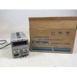 An Instek Laboratory D.C power supply machine with original box. Model number PS 3030D. With