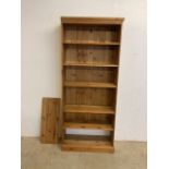 A set of modern pine wall shelves. Three adjustable shelves above two set shelves. W:82cm x D:31cm x