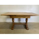 A Shapland and Petter arts and crafts mid century golden oak extending dining table. Extended W: