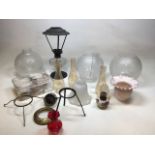 A collection of shades for oil lamp and oil lamp accessories including wicks and fixings