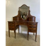 A serpentine fronted Georgian style inlaid dressing table with bow fronted drawers. W:122cm x D:56cm