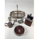 A silver mounted coaster with wooden base together 2 hip flasks, a silver plated basket and other